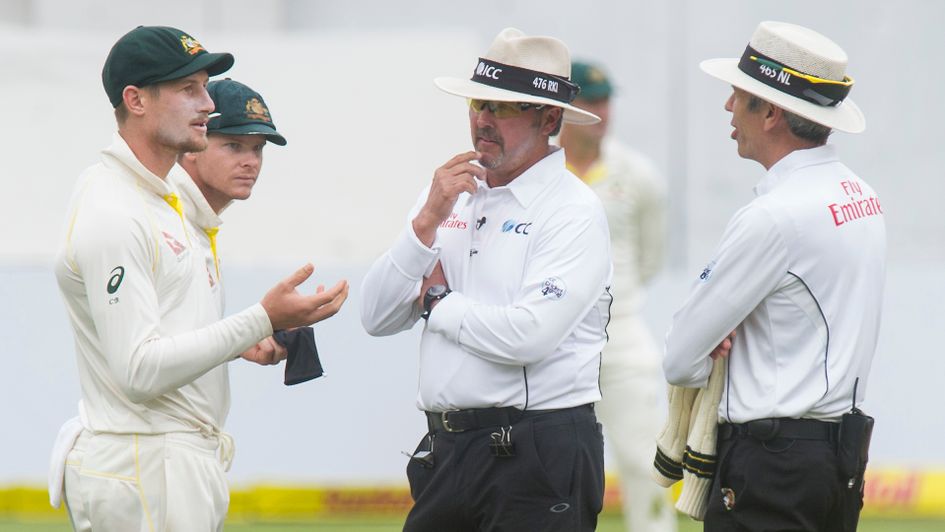 Cameron Bancroft and Steve Smith talk to the umpires