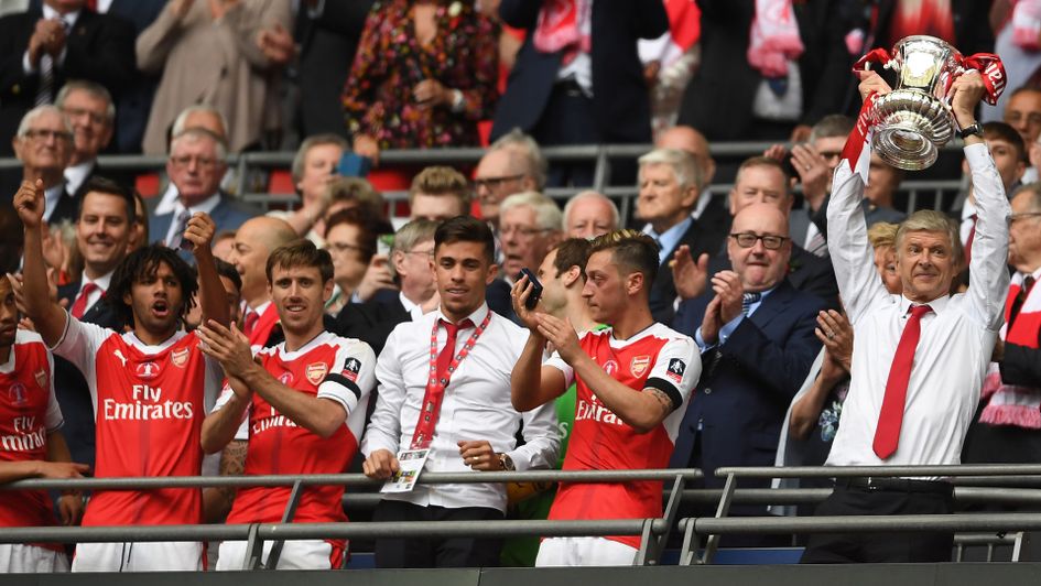Arsene Wenger lifts the FA Cup