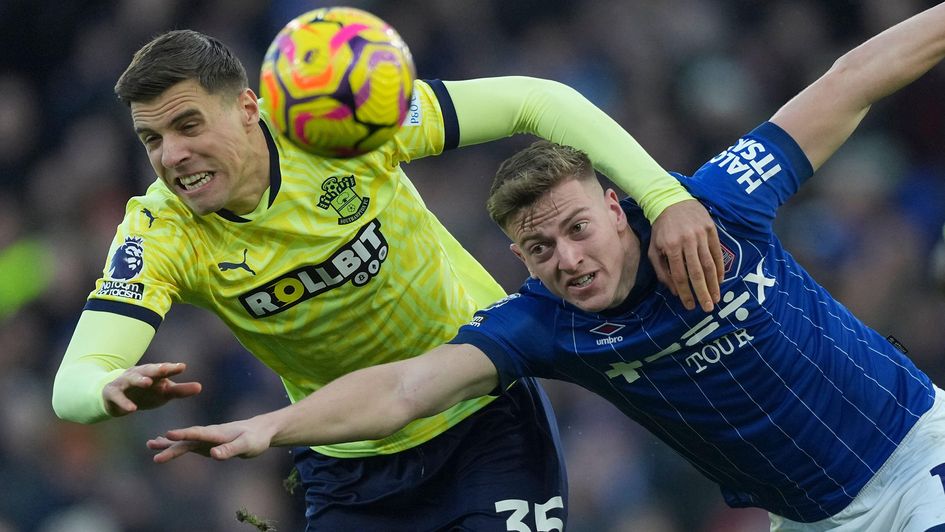Ipswich Town's Liam Delap in a challenge with Southampton's Jan Bednarek
