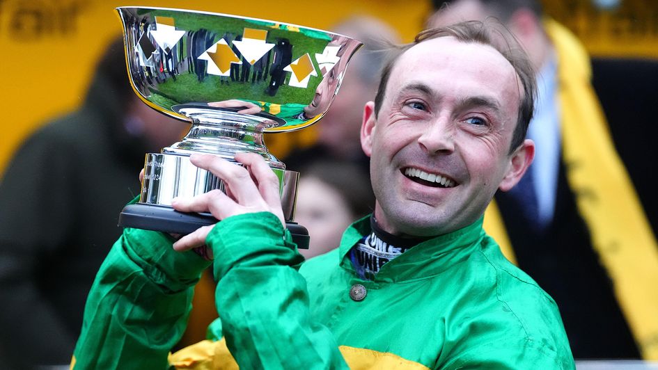 Nico de Boinville celebrates with the trophy after winning the Betfair Tingle Creek Chase