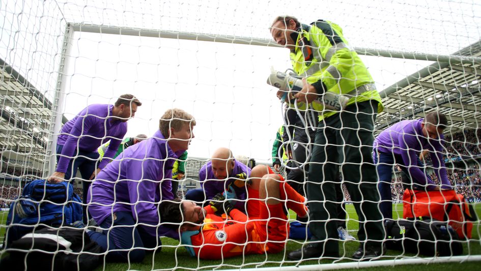 Hugo Lloris: Tottenham goalkeeper receives treatment after injuring his arm v Brighton
