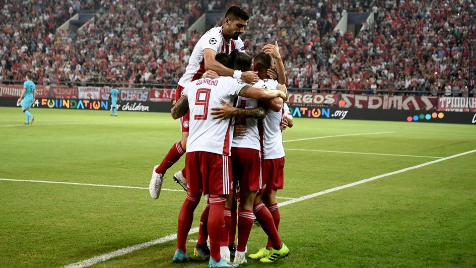 Olympiacos celebrate their equaliser against Tottenham