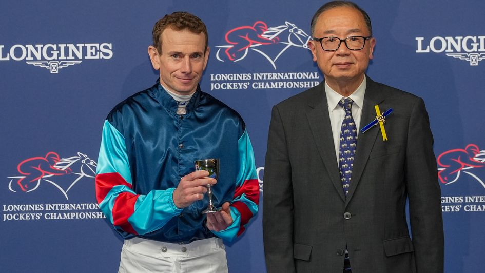 The Hon Martin Liao GBM GBS JP, Chairman, The Hong Kong Jockey Club presents a silver goblet to Ryan Moore