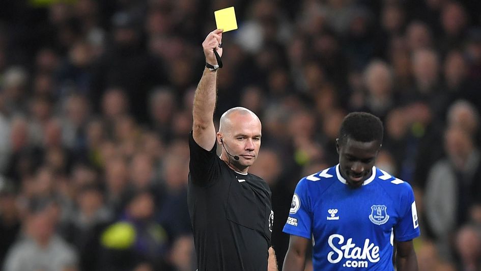 Everton's Idrissa Gueye is shown a yellow card