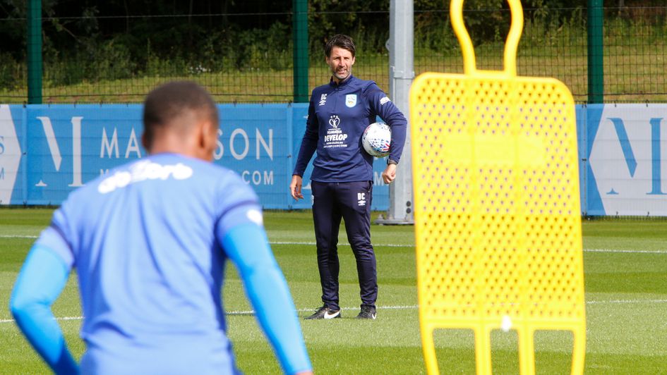 Danny Cowley watches over training
