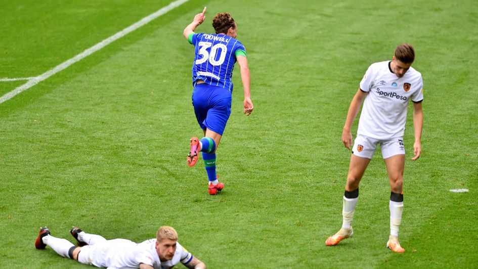 Kieran Dowell: Wigan forward celebrates his hat-trick in the 8-0 thrashing of Hull