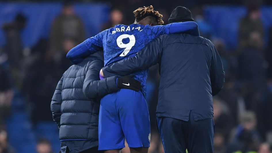 Tammy Abraham: Chelsea forward is helped off the field after the 2-2 draw with Arsenal