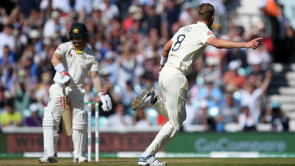 Stuart Broad takes the wicket of David Warner