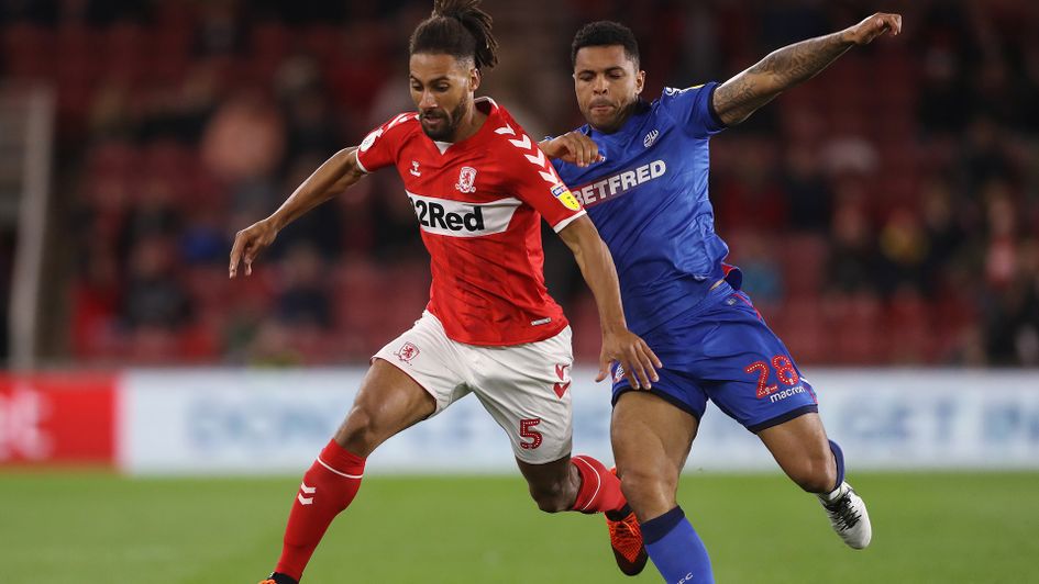 Middlesbrough's Ryan Shotton and Bolton Wanderers' Josh Magennis (right) battle for the ball