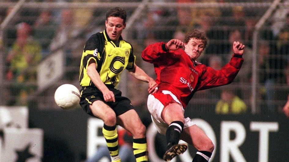 Dortmund's Paul Lambert (left) battles for the ball with Manchester United's Ole Gunnar Solskjaer