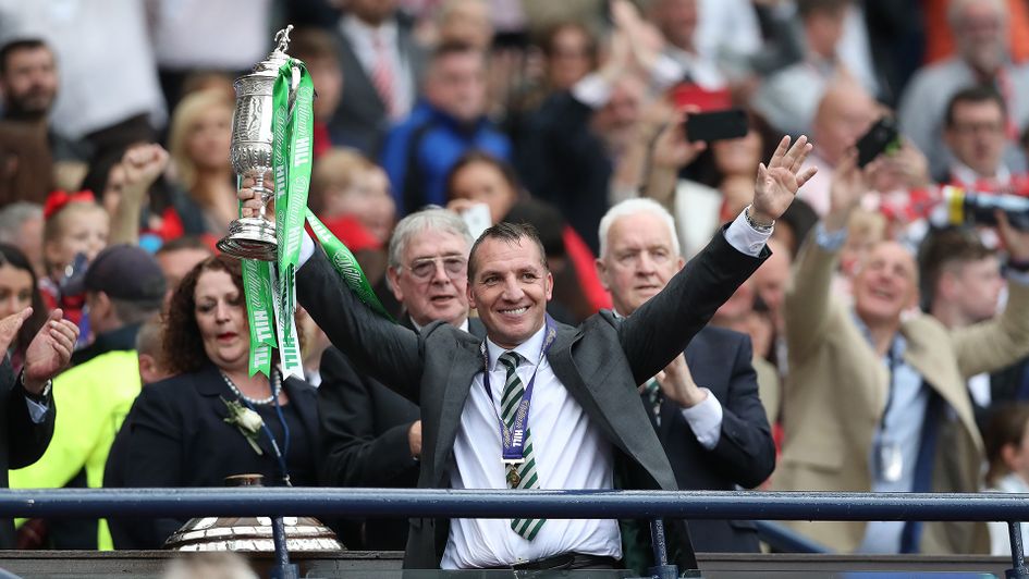 Brendan Rodgers with one of the trophies he won at Celtic