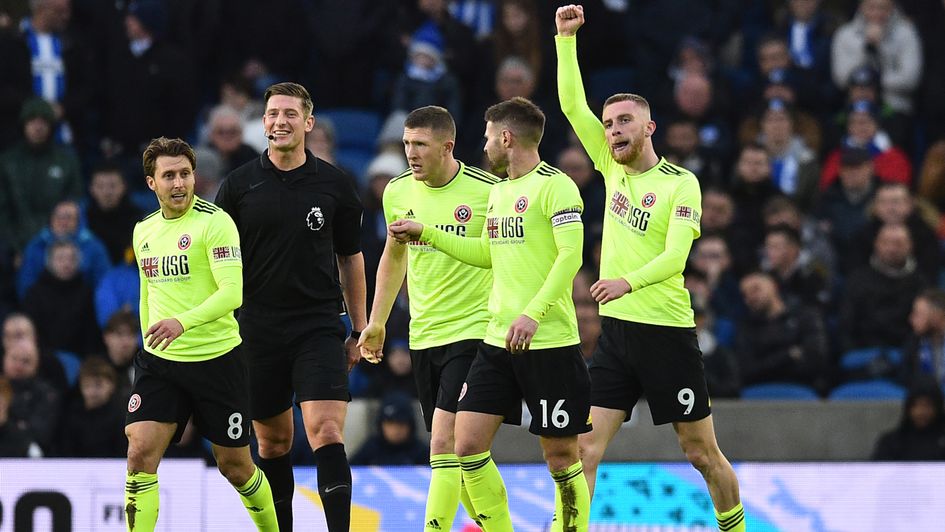 Oli McBurnie (right): Sheff United celebrate forward's goal at Brighton