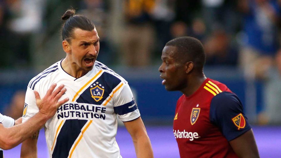 Zlatan Ibrahimovic squares up to former Man City defender Nedum Onuoha in the MLS