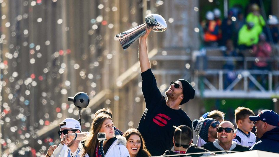 Tom Brady holds the Vince Lombardi Trophy in Boston after the New England Patriots won the Super Bowl