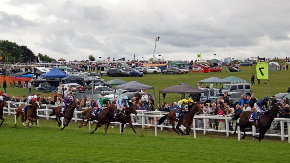 The scene from Tattenham Corner in this year's Derby