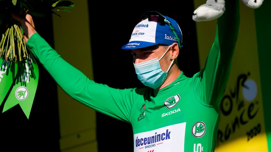Sam Bennett celebrates as victory on stage 10 of the Tour de France took him into green