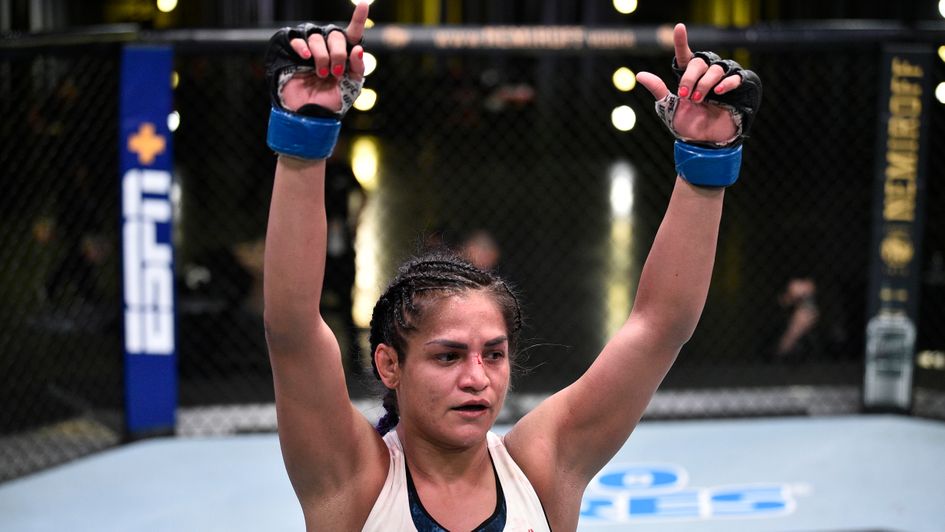 Cynthia Calvillo celebrates victory over Jessica Eye