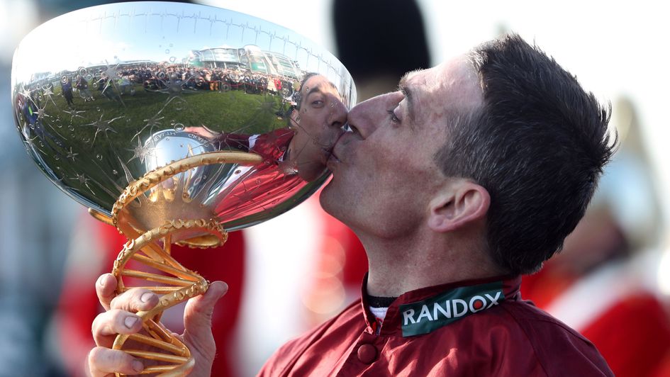 Davy Russell celebrates with the Grand National trophy