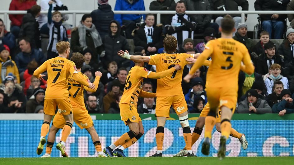 Joe Ironside celebrates with teammates after scoring the opening goal against Newcastle United