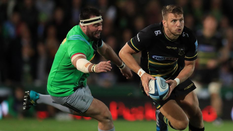Northampton's Dan Biggar carries the ball forward against Harlequins