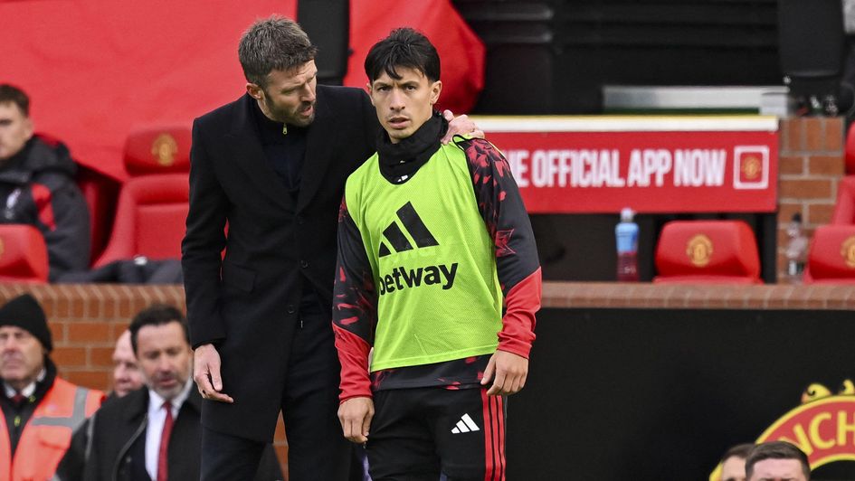 Lisandro Martinez and Michael Carrick in conversation in Man Utd's defeat against Bournemouth