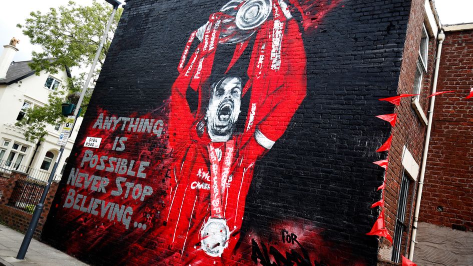 A mural of Jordan Henderson with the Premier League trophy in Liverpool