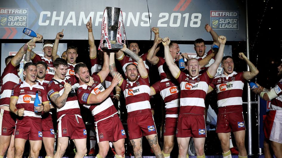 Wigan lift the Super League trophy after winning the 2018 Grand Final