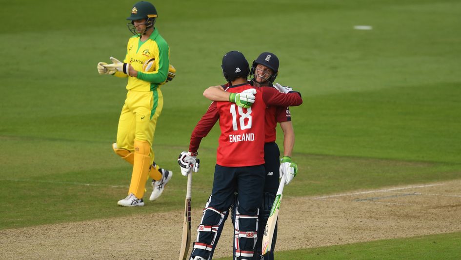 Jos Buttler (right) and Moeen Ali celebrate England's 2nd T20 international victory over Australia