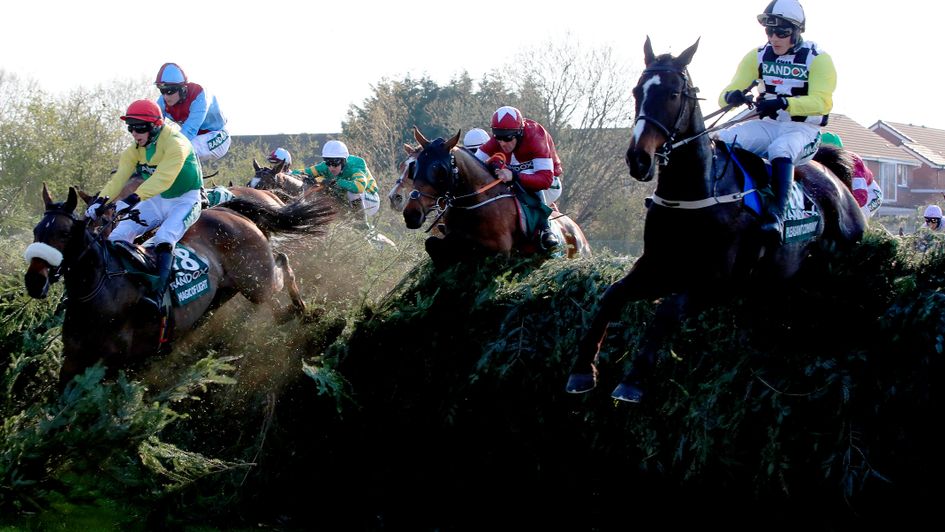 Magic Of Light and Pleasant Company jump Becher's Brook for the second time