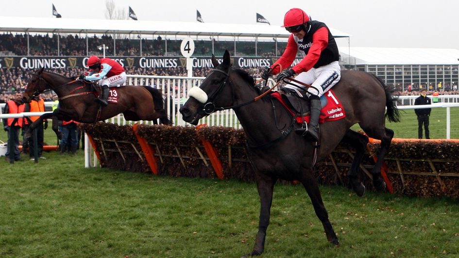 Big Buck's (near side) jumps the last on his way to victory in the 2012 World Hurdle