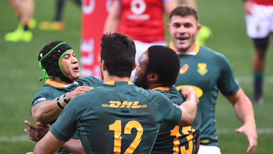 South Africa players celebrate after Lukhanyo Am's vital try