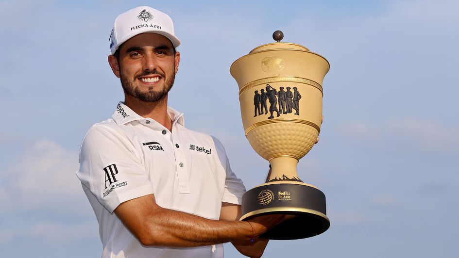 Abraham Ancer poses with the trophy after winning the FedEx St. Jude Invitational
