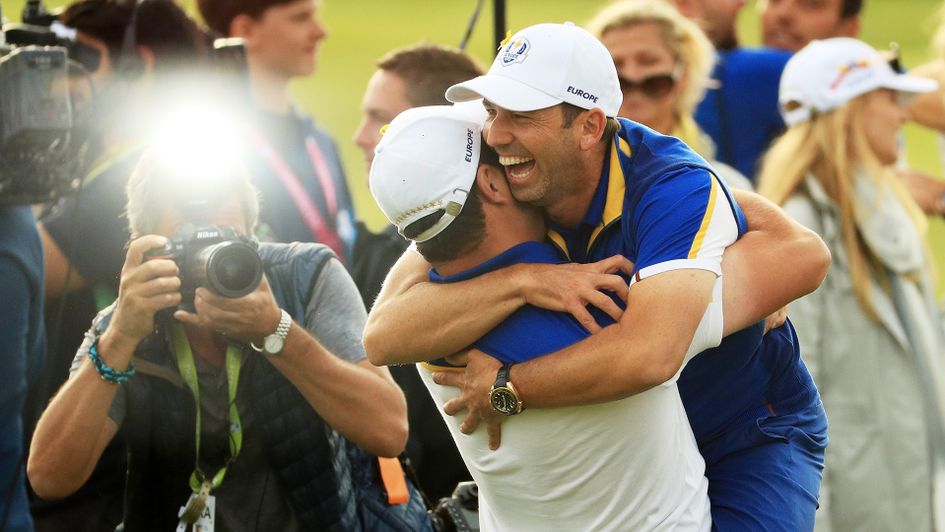 Jon Rahm embraces history-making Sergio Garcia