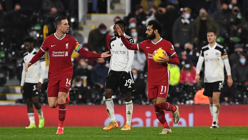 Mo Salah celebrates his goal against Fulham with Jordan Henderson