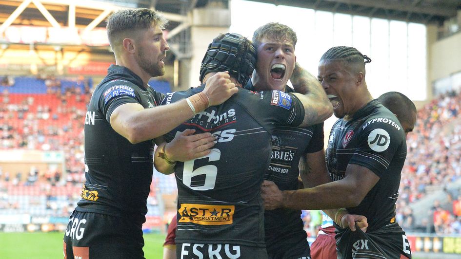 St Helens' Morgan Knowles is congratulated on scoring his team's second try