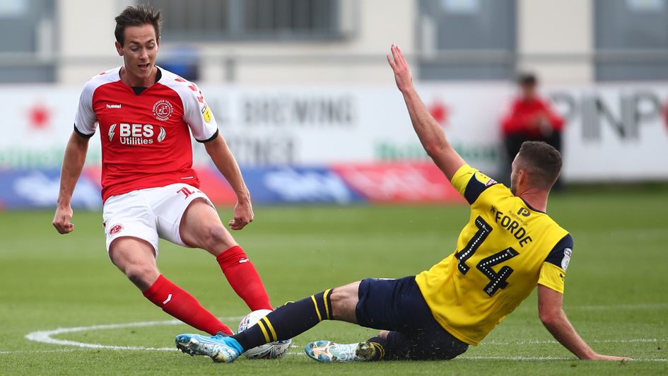 Josh Morris and Anthony Forde battle for the ball