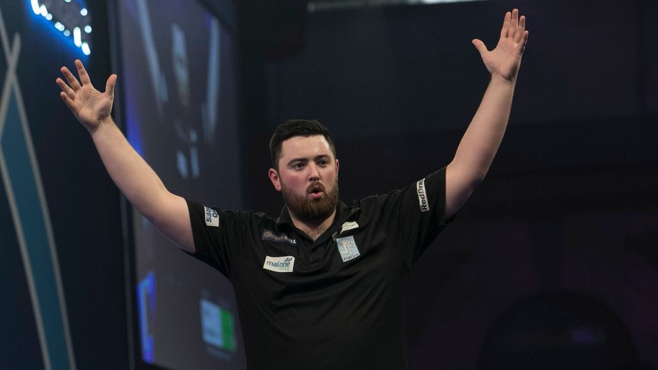 Luke Humphries celebrates a famous win (Picture: Lawrence Lustig)