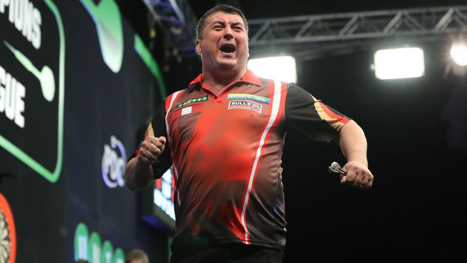 Mensur Suljovic celebrates at the Champions League of Darts (Pic: Lawrence Lustig)