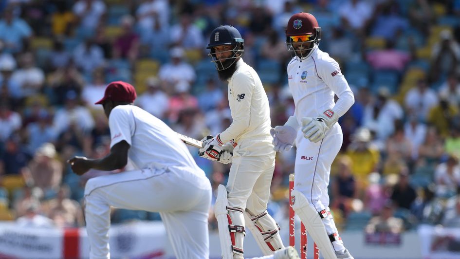 Moeen Ali of England is caught by West Indies captain Jason Holder