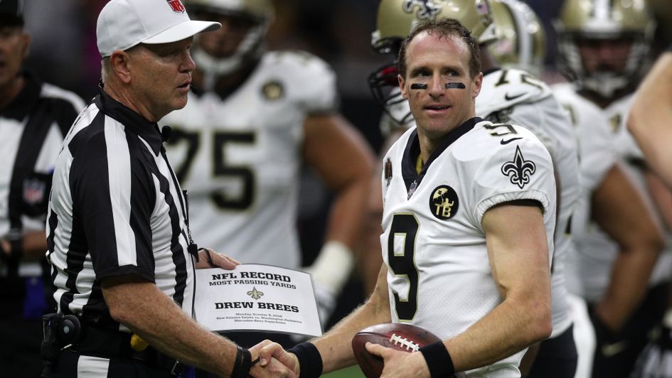 Drew Brees celebrates his remarkable achievement