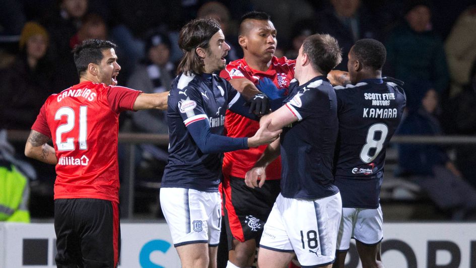 Dundee and Rangers players enjoy a discussion