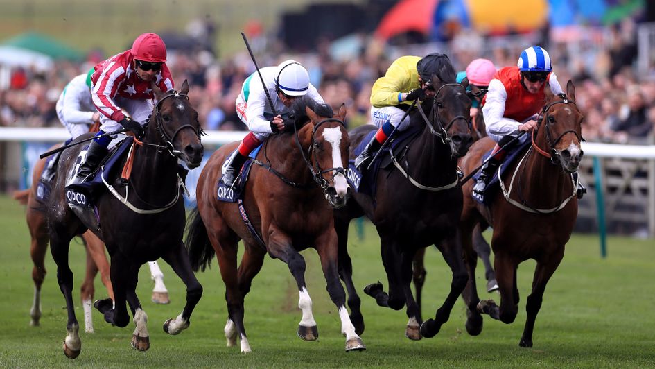 Baghdad (far left) wins the opening handicap on 1000 Guineas day from Corelli and Fire Fighting