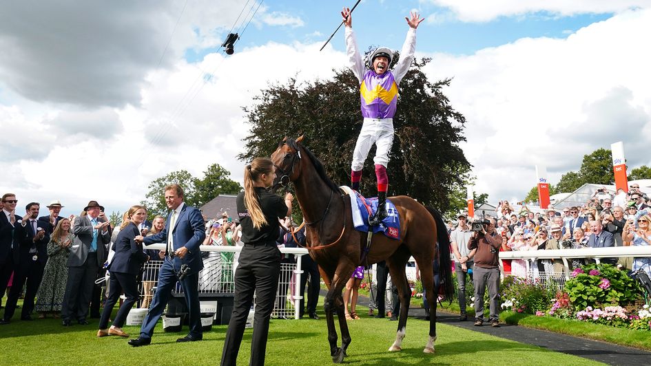 Frankie Dettori leaps from one of his York winners, Kinross