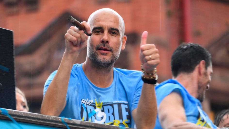 Pep Guardiola celebrates Man City treble