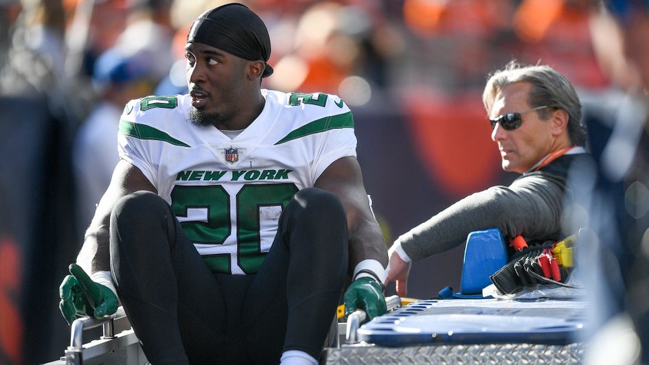 Breece Hall of the New York Jets is carted off the field