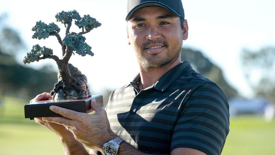 Jason Day with the Farmers trophy