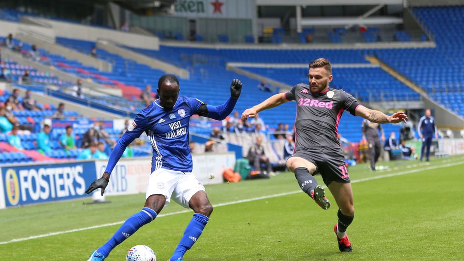 Cardiff's Albert Adomah (left) and Leeds' Stuart Dallas battle