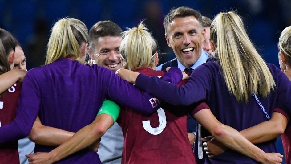 England's players and manager Phil Neville celebrate their win over Argentina