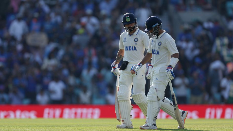 India's Virat Kohli (left) and Ajinkya Rahane leave the field and the end of the day's play