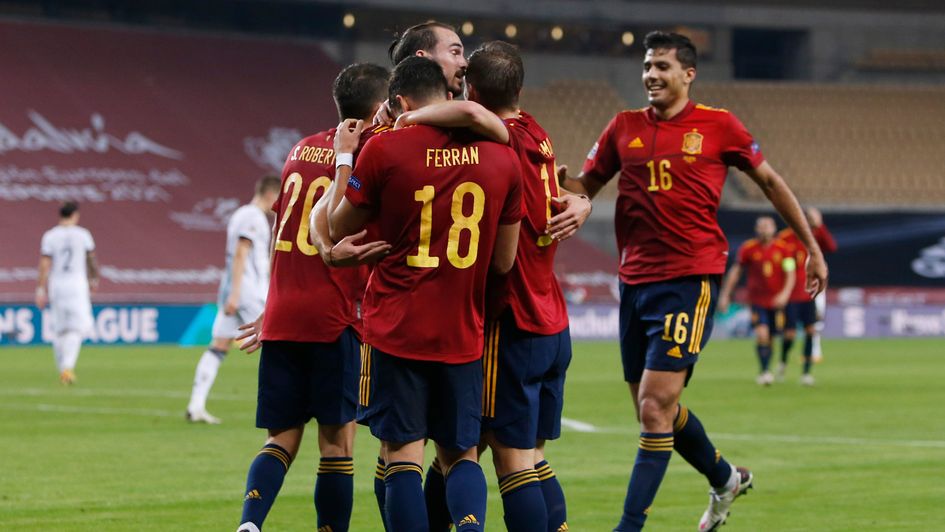Spain celebrate their thumping win over Germany